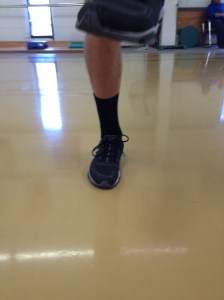 Foot is flat, but pressure is on the ball of the foot